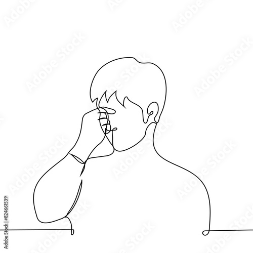 man stands holding the bridge of his nose - one line art vector. concept of fatigue, cringe