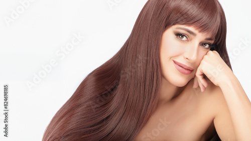 Beautiful model with healthy long hair on white background, exemplifying beauty and hair care