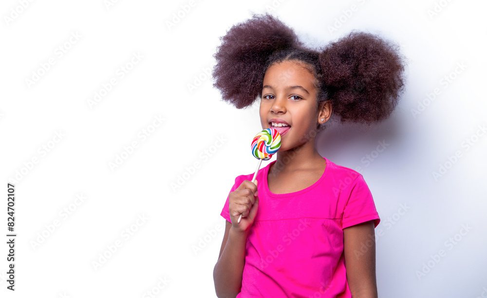 Funny african child with candy lollipop, happy little girl eating sugar lollipop. Girl afro, lollipops. Smile little american girl eating lollipop, holding pink sweet colorful lollipop candy, sweets Funny african child with candy lollipop, happy little girl eating sugar lollipop. Girl afro, lollipops. Smile little american girl eating lollipop, holding pink sweet colorful lollipop candy, sweets