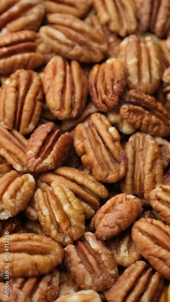 Heap of pecan nuts close up, rotation. Healthy food concept Heap of pecan nuts close up, rotation. Healthy food concept