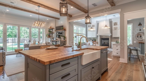 A modern farmhouse living room with shaker cabinets, a farmhouse sink, and a butcher block island.  photo