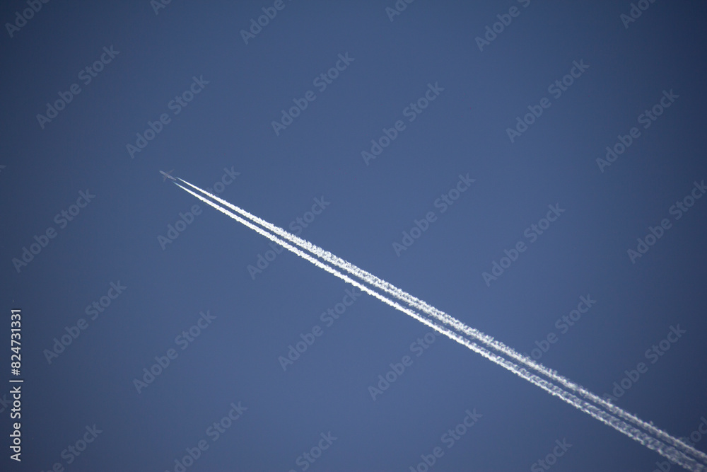 The flight of airplanes and the line behind them, which is known as the cantrail, in the sky of the Kurdistan province of Iran The flight of airplanes and the line behind them, which is known as the cantrail, in the sky of the Kurdistan province of Iran