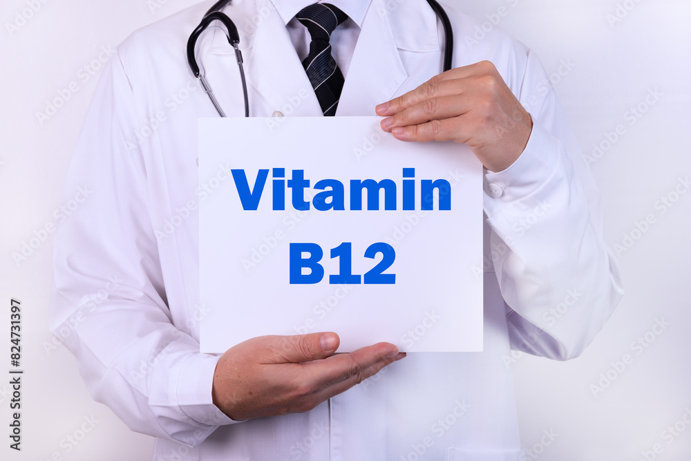 Doctor holding a card with Vitamin B12, medical concept Doctor holding a card with Vitamin B12, medical concept