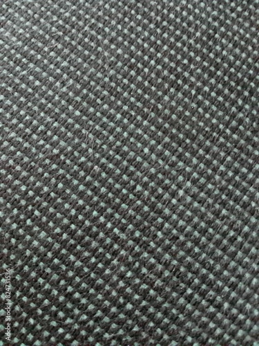 Black and Green Uniform Woven Fabric Surface. Abstract Background.
