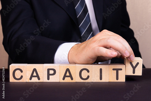 Man made word Capacity with wood blocks