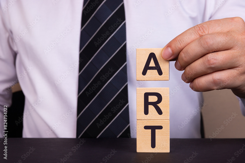 Businessman made word ART with wood building blocks. Businessman made word ART with wood building blocks.