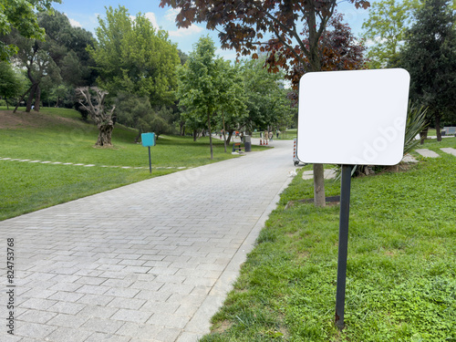 blank billboard mockup by path in the park in spring