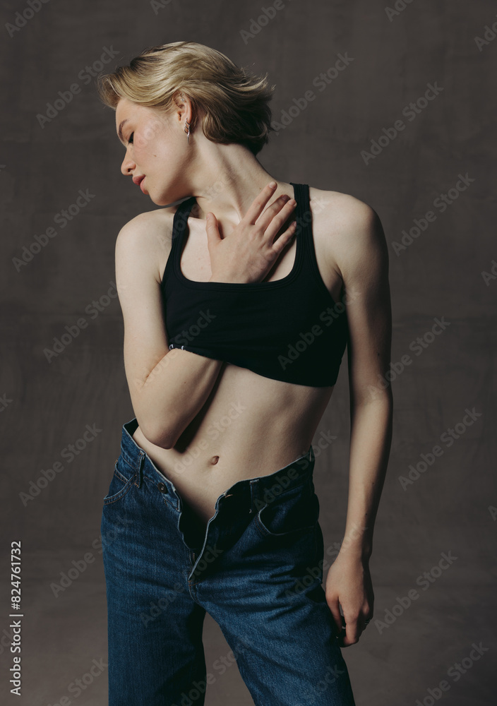 Fashionable and beautiful portraits of beautiful girl in jeans, short haircut and blonde hair Fashionable and beautiful portraits of beautiful girl in jeans, short haircut and blonde hair