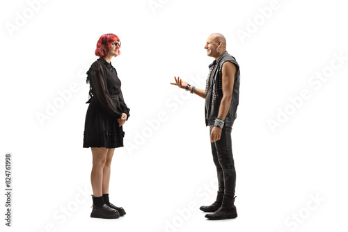 Punk talking to a young woman in a black dress