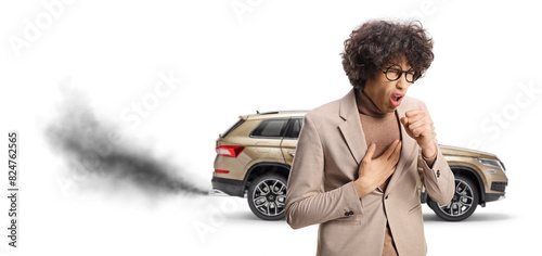 Bilde på lerret Young man coughing in front of a vehicle with exhaust fume dangerous to inhale