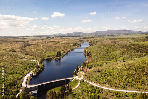 Talsperre mit See im Harz. Im Hintergrund Brocken und Wurmberg photo