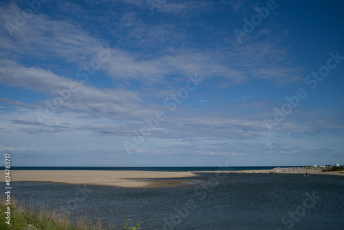 Mouth of the Agly France, landscape with river clouds over the sea © marguerite