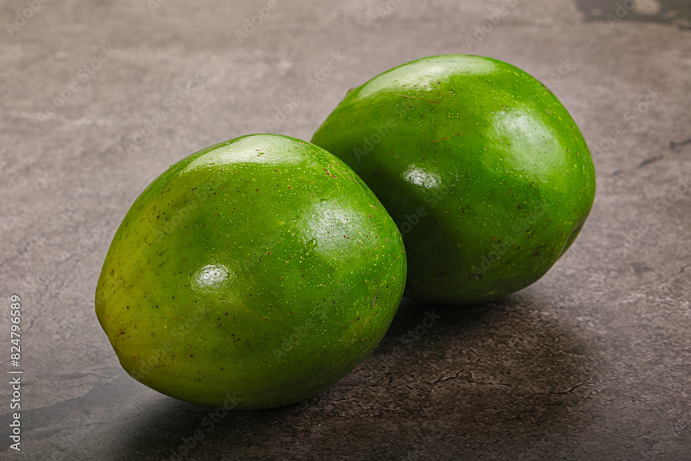 Obraz premium Two ripe green exotic avocado fruit