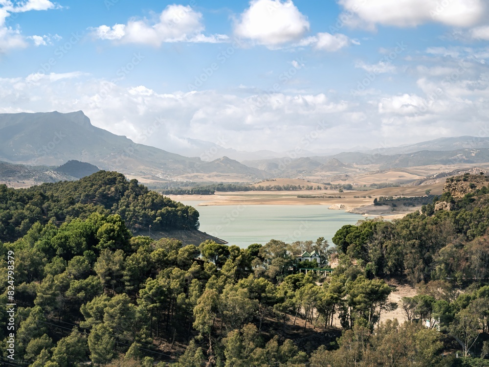 Fototapeta premium The Penarrubia dam lake water reservoir on the Guadalhorce river for producing electricity, green renewable energy, in Andalusia