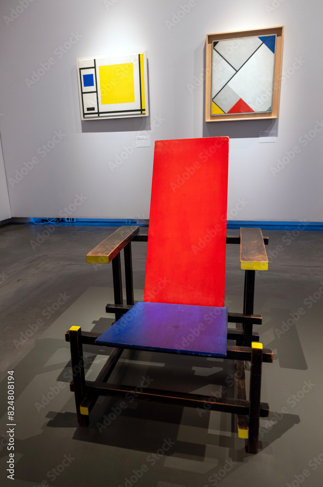rietveld chair and paintings of de stijl on wall of centraal museum in utrecht