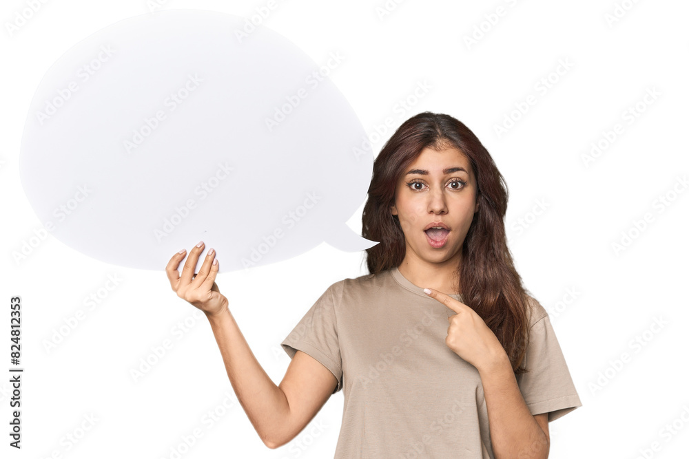 Middle Eastern woman holding comic bubble pointing to the side Middle Eastern woman holding comic bubble pointing to the side