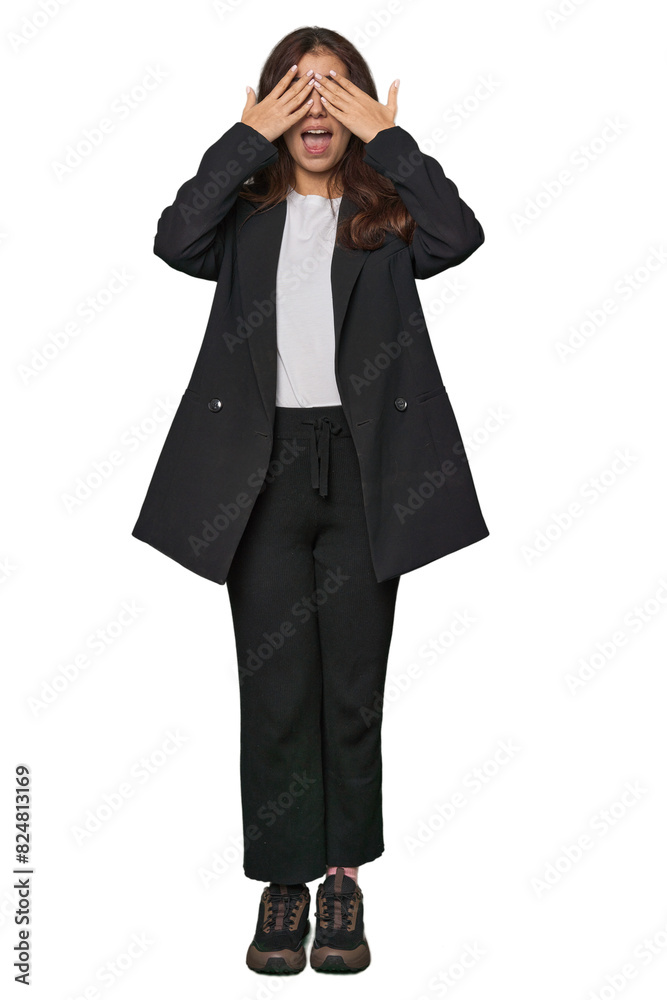 Middle Eastern in business attire covers eyes with hands, smiles broadly waiting for a surprise. Middle Eastern in business attire covers eyes with hands, smiles broadly waiting for a surprise.
