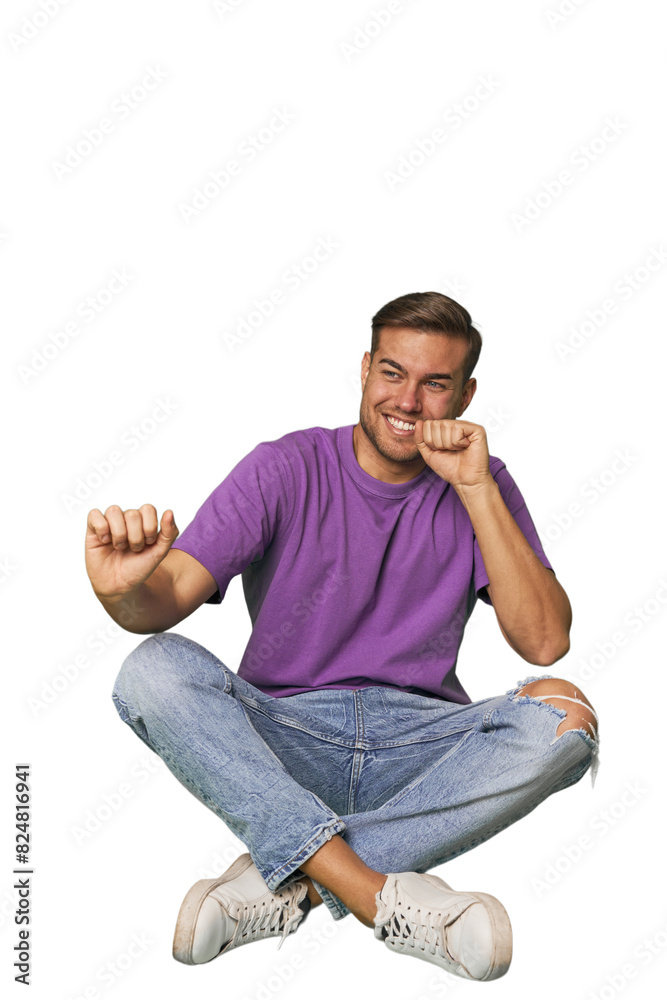 Casual man sitting on floor dancing and having fun. Casual man sitting on floor dancing and having fun.