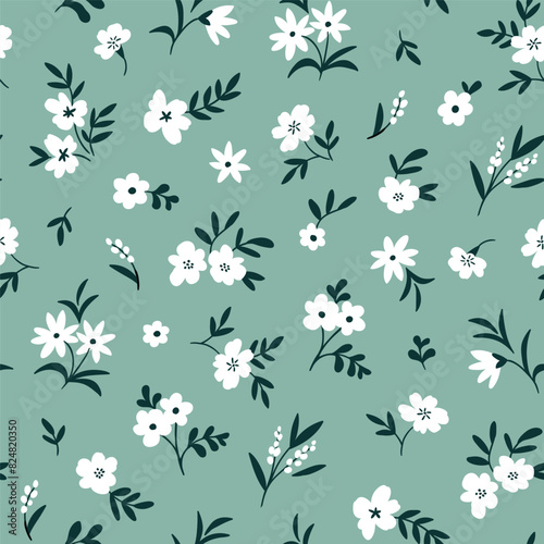 Ditsy floral seamless pattern. Set of summer daisy white flowers on mint background. Simple flat modern drawing. Floral seamless texture for textile and fashion design. Spring botanical print