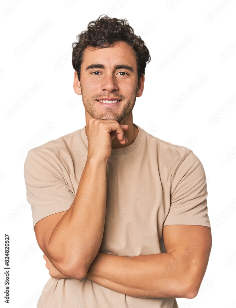 Young Hispanic man in studio smiling happy and confident, touching chin with hand. Young Hispanic man in studio smiling happy and confident, touching chin with hand.