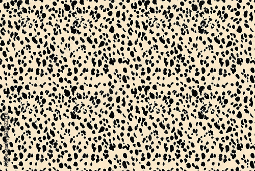 Classic black and white leopard spots create a seamless pattern  ideal for stylish and trendy designs. 