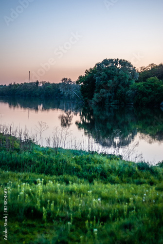 Lake and forest . Summer lake . Green woods and green field . Lake and reflactions on water . Green trees . Blue water . Forest on lake  photo