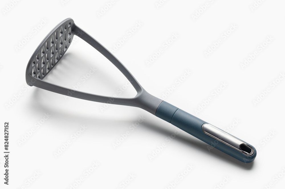 Plastic potato masher for making mashed potatoes. Kitchen utensils on white. Plastic potato masher for making mashed potatoes. Kitchen utensils on white.