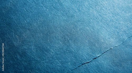 Close-up of a piece of blue paper with a visible crack