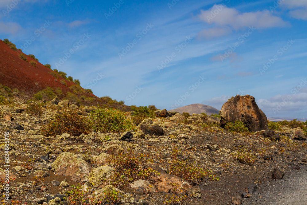Haking trail around Montana Colorada.   Huge volcanic bomb. Lanzarote island, Canary islands, Spain, Europe