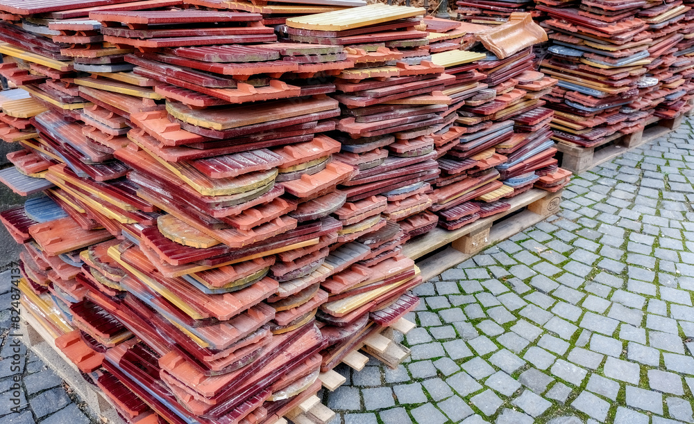 A pile of neatly stacked used tiles A pile of neatly stacked used tiles