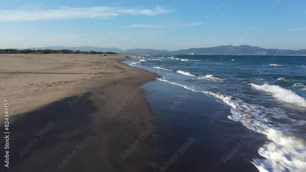Beautiful drone view of Mediterranean sea. Waves and blue water. Catalonia, Spain, Europe. Paradise beach for vacations. Holidays destination in summertime.
