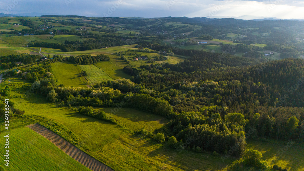 Lesser Poland rolling hills and rural landscape near Ciezkowice. Aerial drone view