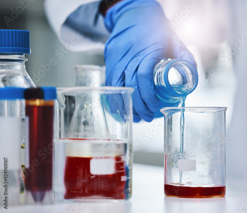 Foto Beaker, blood and hand for research or testing, sample and science for medical data for healthcare