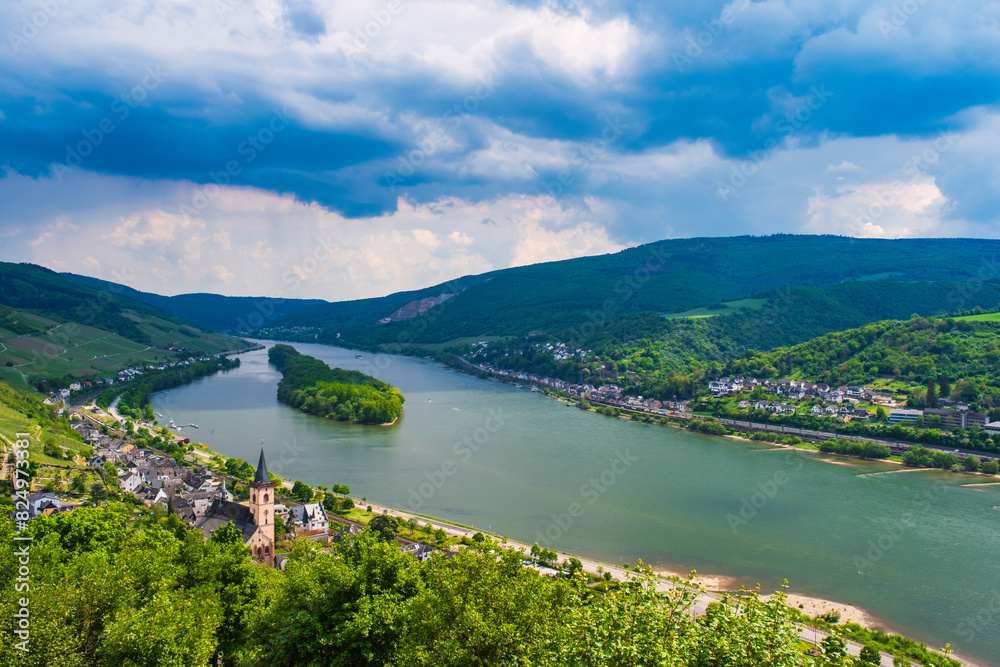 View from a hiking trail in the Rheingau Mountains near Lorch down into the Rhine Valley on a sunny spring day View from a hiking trail in the Rheingau Mountains near Lorch down into the Rhine Valley on a sunny spring day