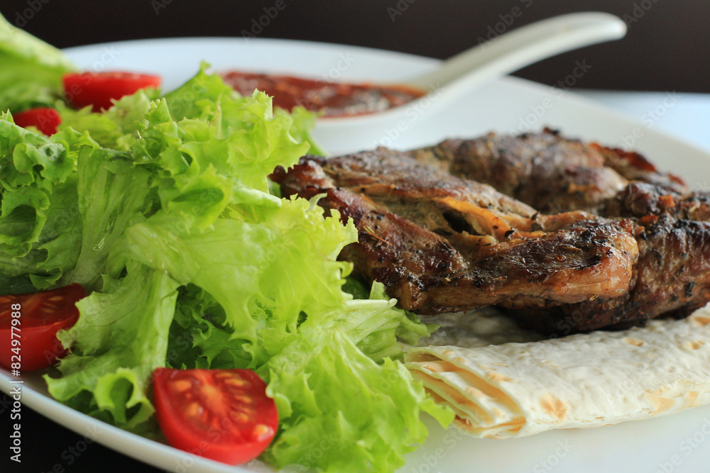 Closeup Stock Photo Of Fried Meat And Greens Setting
