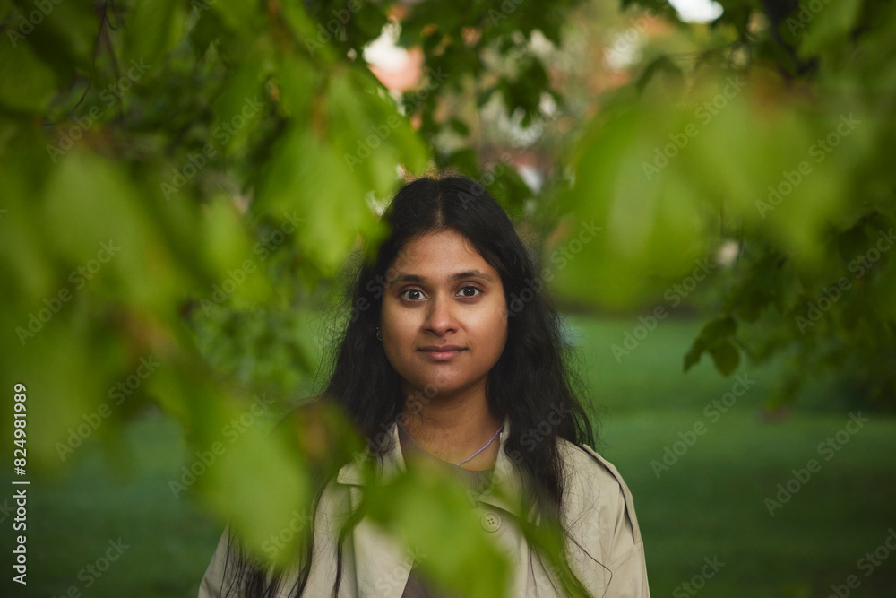 Portrait of confident woman standing in park Portrait of confident woman standing in park