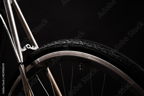 close up of bicycle wheel and bike frame