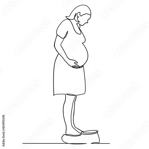 the pregnant woman is weighed on the scales