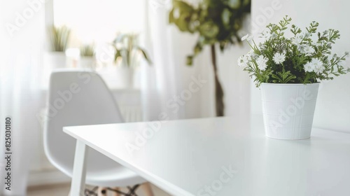 A simple and stylish office chair with a sleek design  placed in front of a plain white desk  illustrating minimalist furniture design.