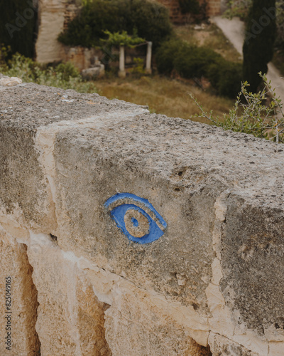 A sculpted eye carved in stone, marking a viewpoint, adding a touch of mystique and allure to surroundings.