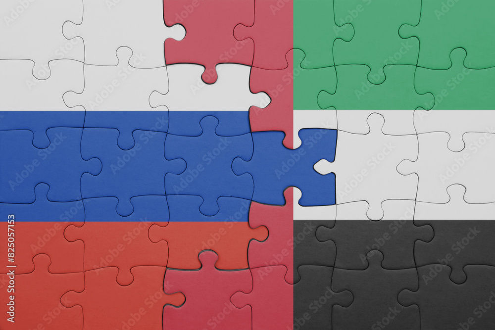 puzzle with the colourful national flag of united arab emirates and flag of russia. puzzle with the colourful national flag of united arab emirates and flag of russia.