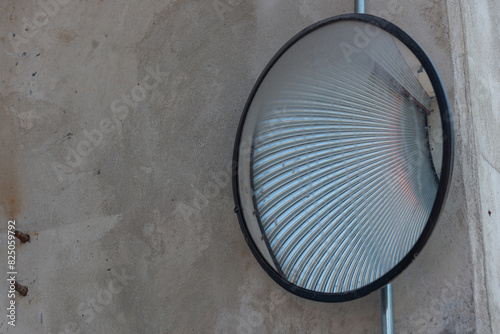 abstract convex mirror outside a garage door entrance or exit photo