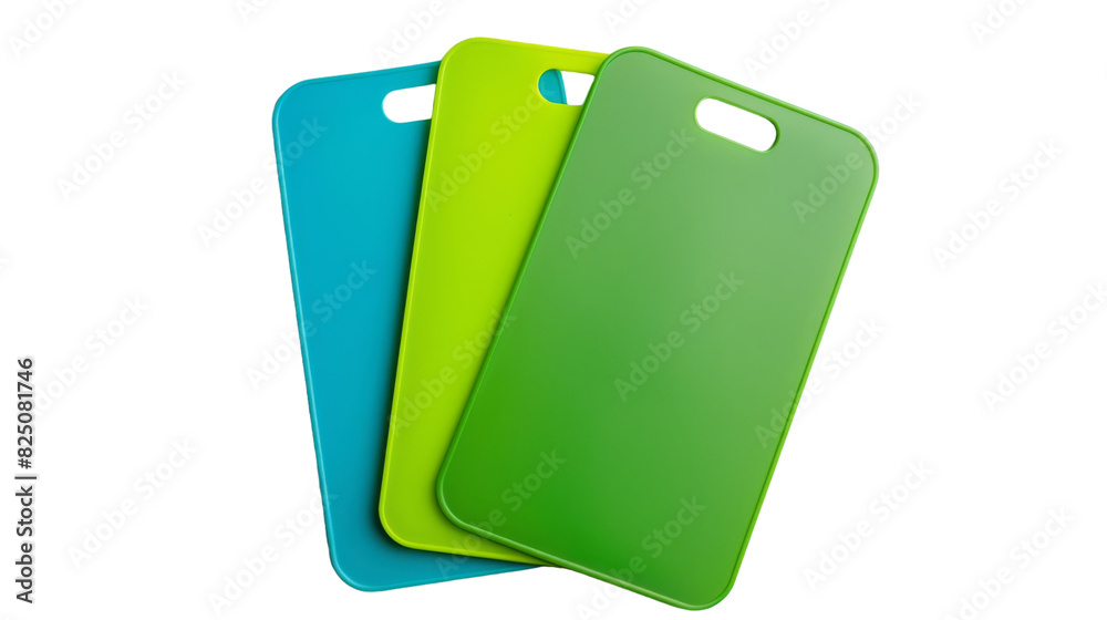 Three plastic cutting boards in different colors - red, blue, and green, stacked neatly on a kitchen counter Three plastic cutting boards in different colors - red, blue, and green, stacked neatly on a kitchen counter