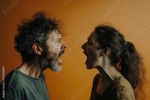 A man and a woman are having an argument. Scene is tense and confrontational photo