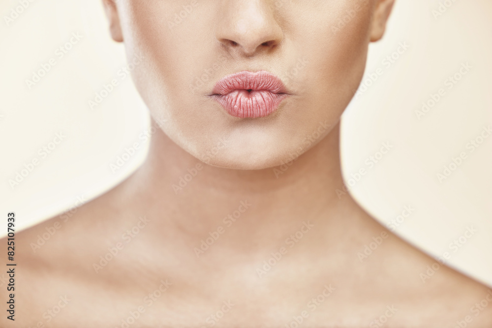 Woman, lips and kiss in studio for beauty with makeup, cosmetics and glow with pride for cosmetology or self care. Girl, zoom and isolated with pout for natural shine and aesthetic for mouth.