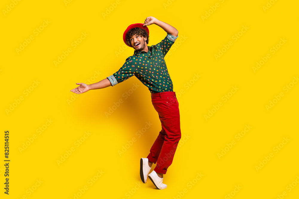 Full size photo of attractive elegant young man dancing wear shirt isolated on yellow color background