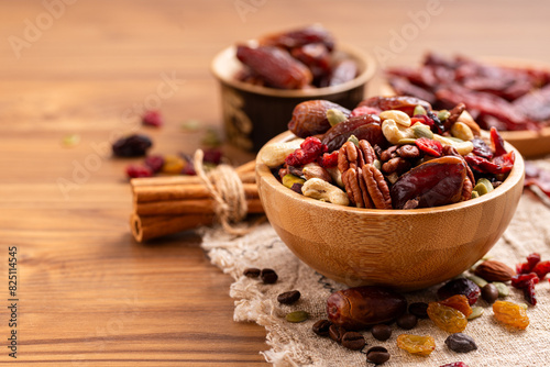 Natural raw foods ingredients and nuts arranged on a wooden table in a flat layout copy space image place for adding text or design. World Pulses Day. African Raw Foods