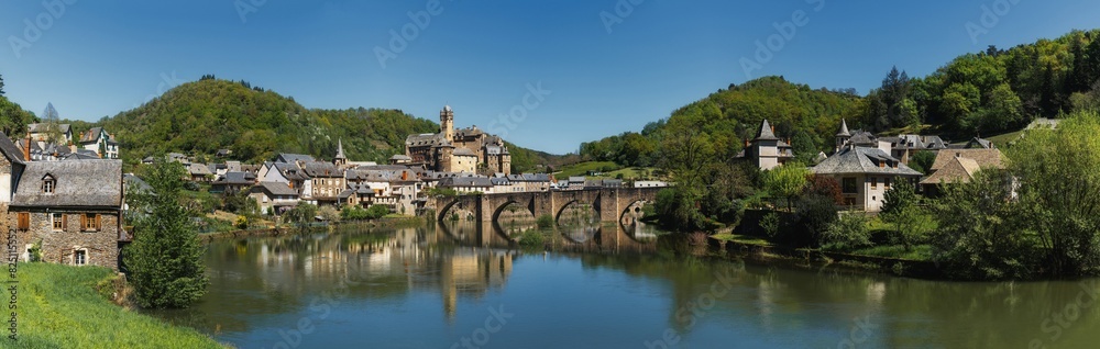 panorama view of the picturesque French village of Estaing on the Lot River in south central France panorama view of the picturesque French village of Estaing on the Lot River in south central France