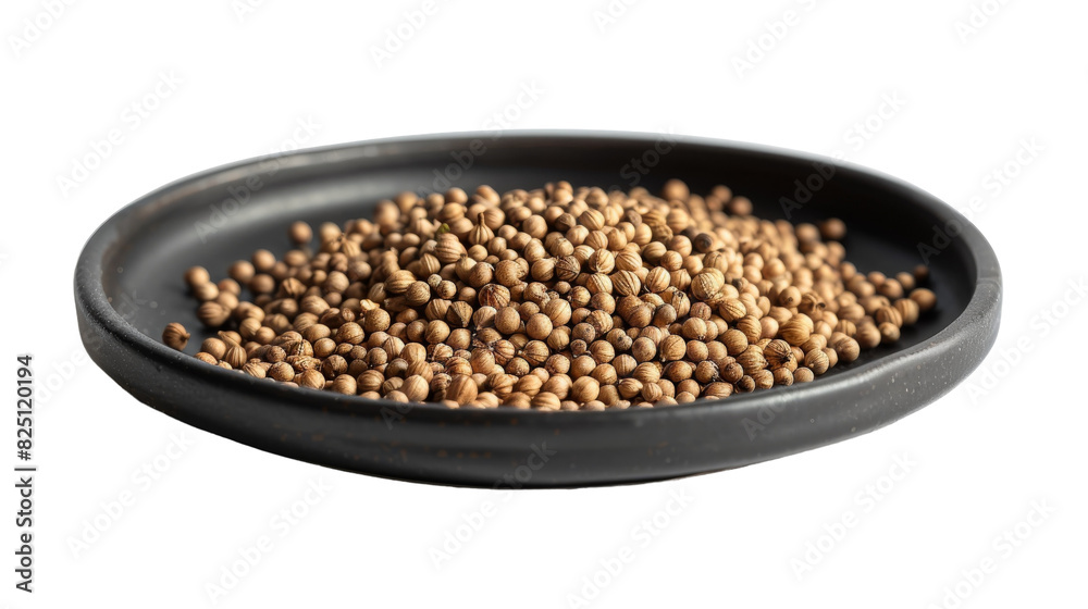 A black bowl containing brown lentils placed on a plain white background A black bowl containing brown lentils placed on a plain white background