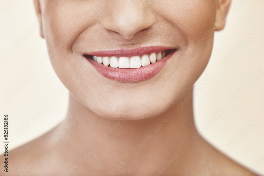 Obraz premium Woman, lips and teeth in studio for beauty with makeup, cosmetics and glow with pride for cosmetology or self care. Girl, zoom and isolated with happiness for natural shine and aesthetic for mouth.